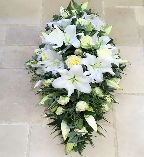 3 Ft Long And Low White Lily’s, White Rose, White Chrysanthemum.