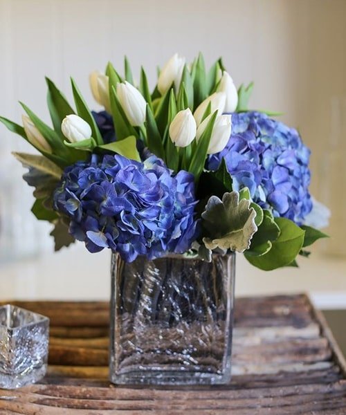 Hydrangea And Tulip In A Glass Vase
