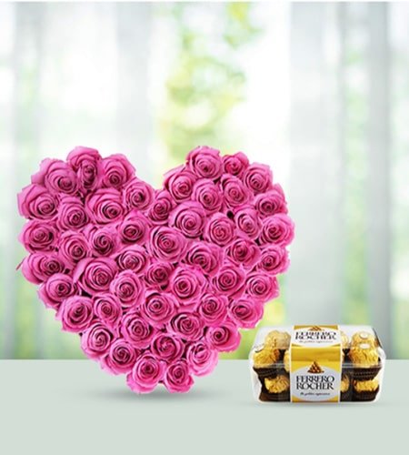 Dazzling Pink Roses Heart Shape Arrangement With Ferrero Rocher Chocolates