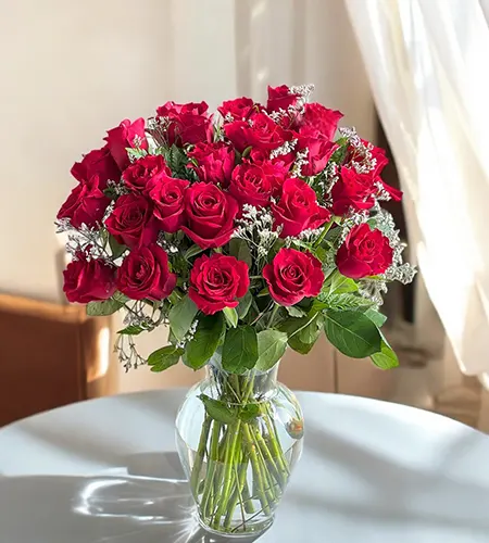 20 Red Roses in Matka Vase with Fresh Fillers