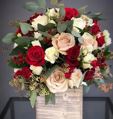 Mix Of Roses Arrangement In A Wooden Vase