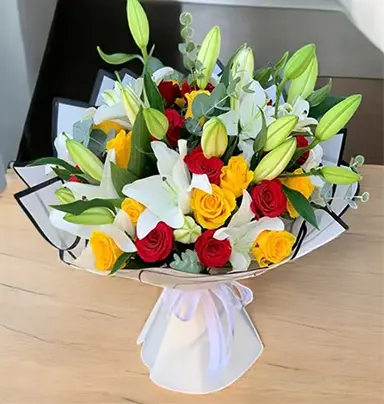 Red, Yellow Roses & White Lily Bouquet - Vibr...